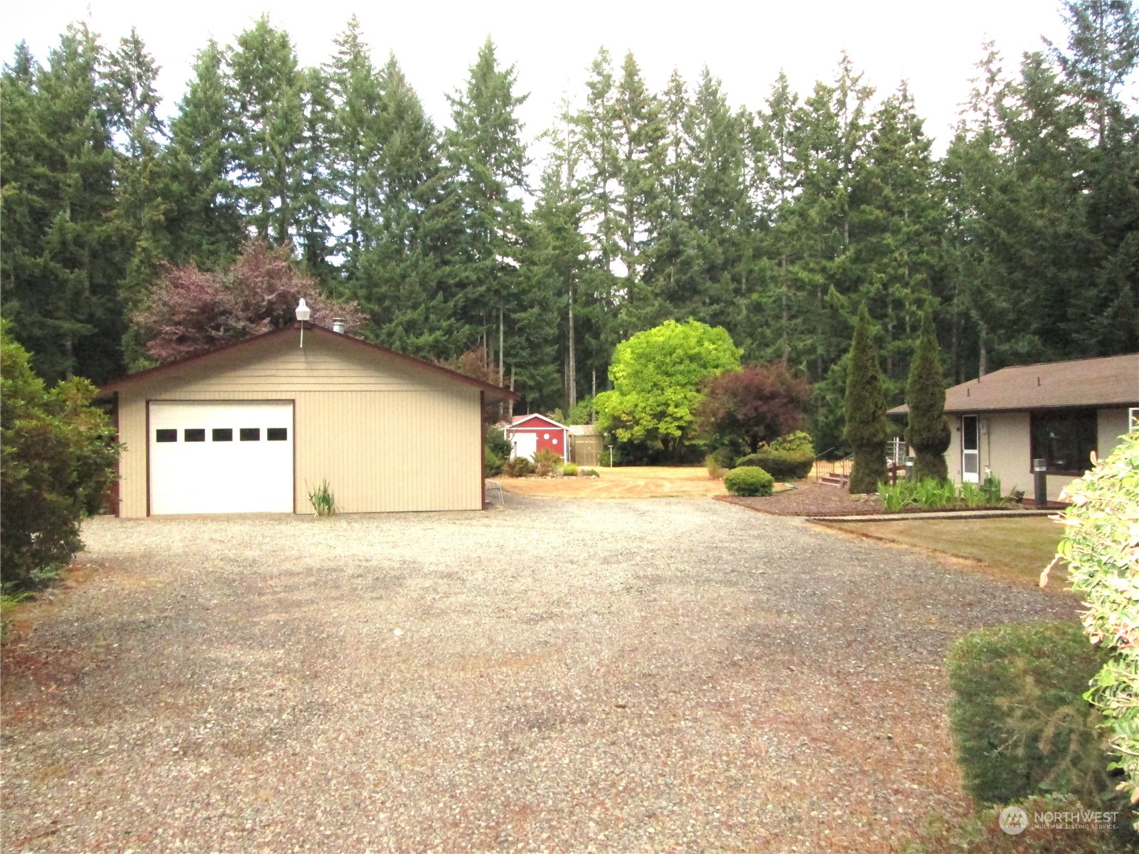 15 Webb Road Southwest Lakebay, WA 98349 - Photo 3 of 39 a view of a house with a yard and garage