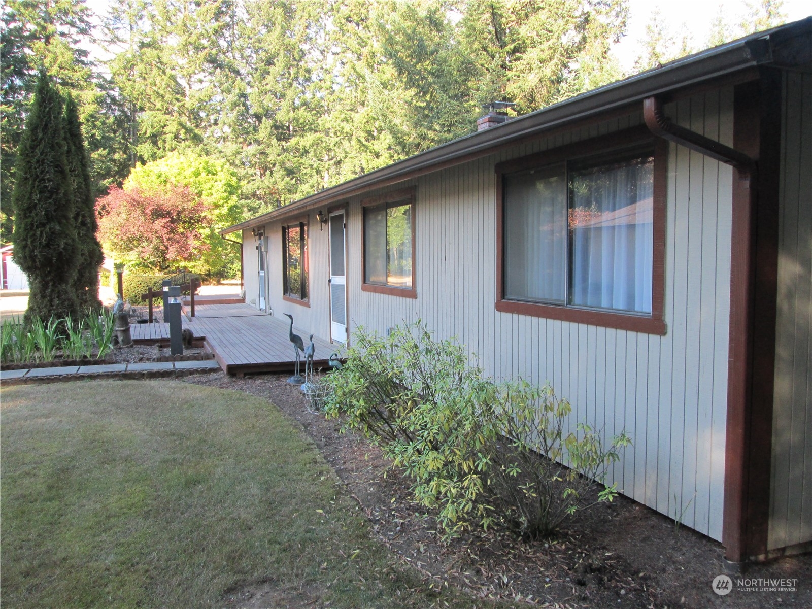 15 Webb Road Southwest Lakebay, WA 98349 - Photo 37 of 39 a backyard of a house with seating space