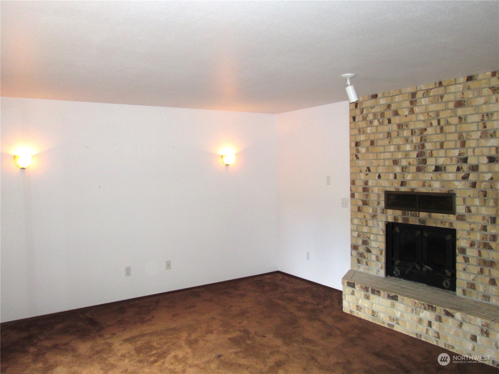 15 Webb Road Southwest Lakebay, WA 98349 - Photo 6 of 39 a view of empty room with a fireplace