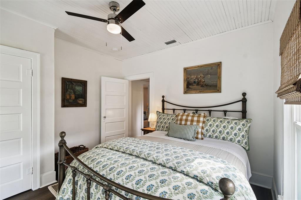 459 Bell Avenue Brooksville, FL 34601 - Photo 27 of 36 a bedroom with a bed and a painting on the wall