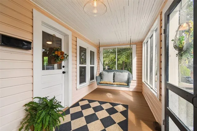 a bedroom with windows