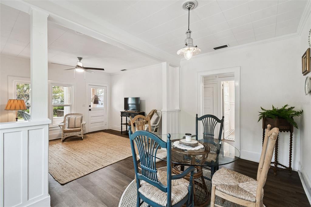 459 Bell Avenue Brooksville, FL 34601 - Photo 8 of 36 a dining room with furniture potted plants and wooden floor