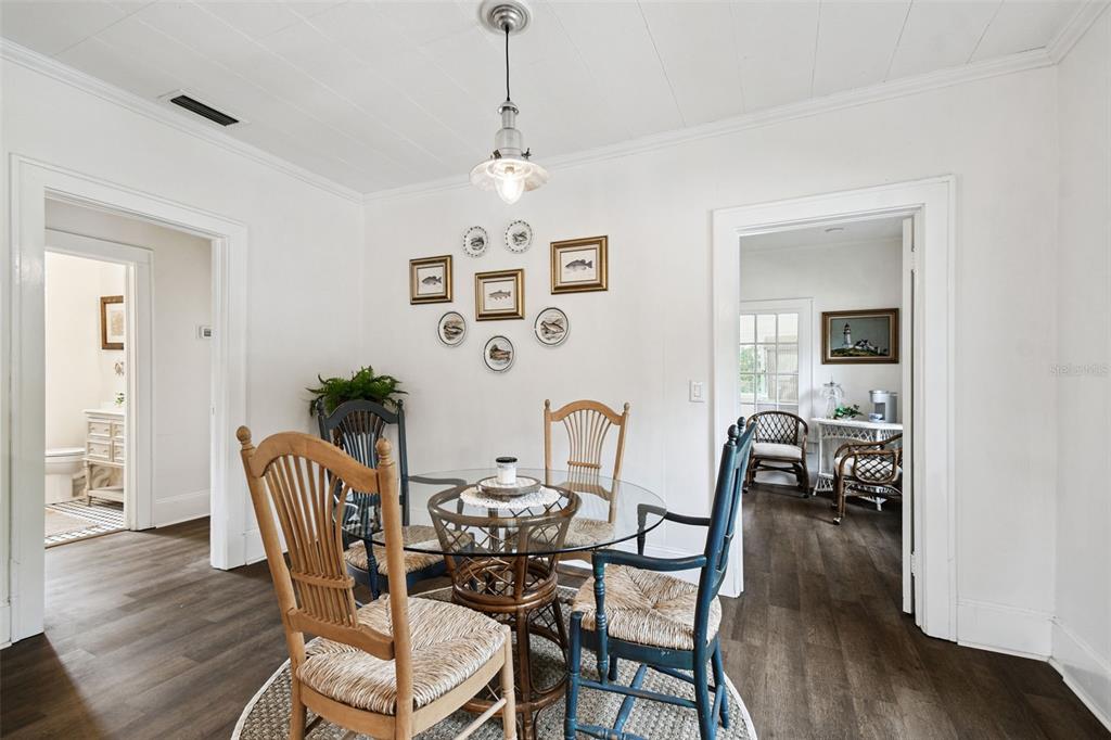 459 Bell Avenue Brooksville, FL 34601 - Photo 9 of 36 a view of a dining room with furniture and wooden floor