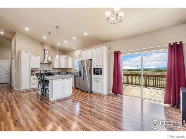 a view of balcony with wooden floor