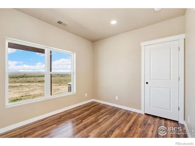a bathroom with a sink a toilet a mirror a vanity and shower