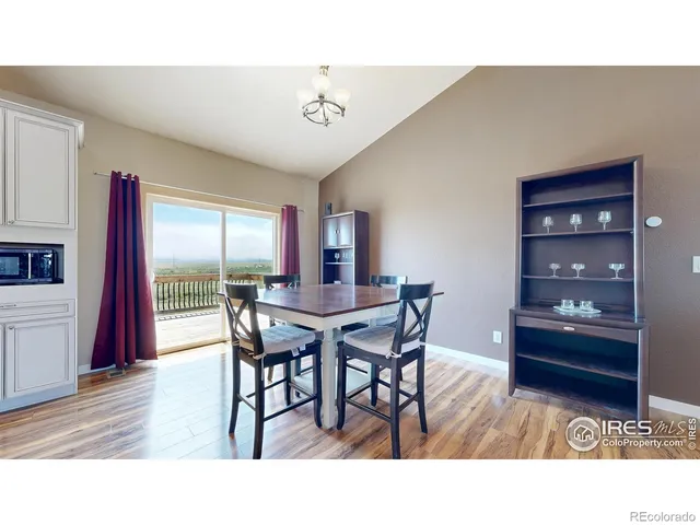 a living room with kitchen island furniture and a wooden floor