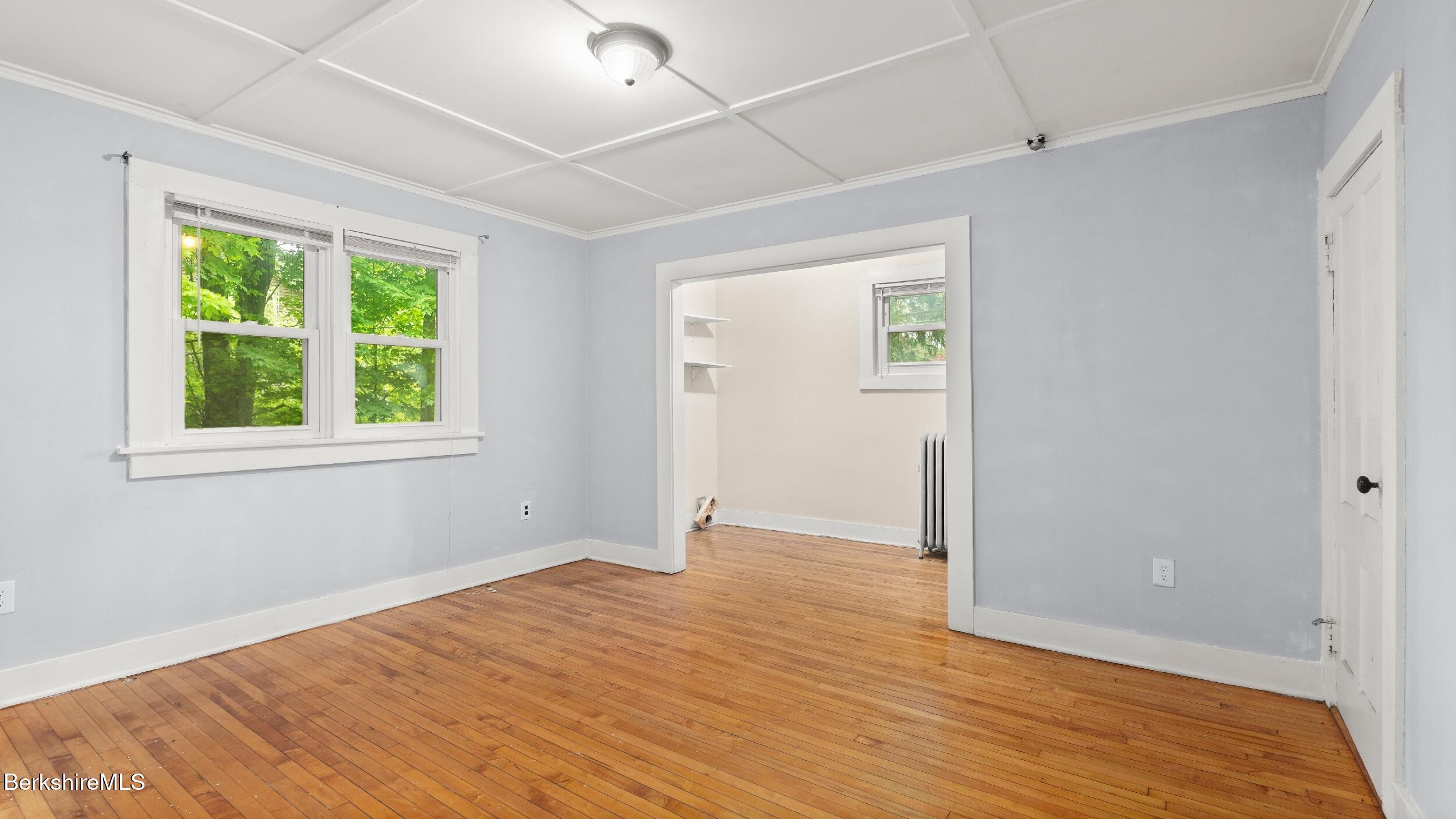 349 New Lenox Road Lenox, MA 01240 - Photo 14 of 22 a view of an empty room with wooden floor and a window