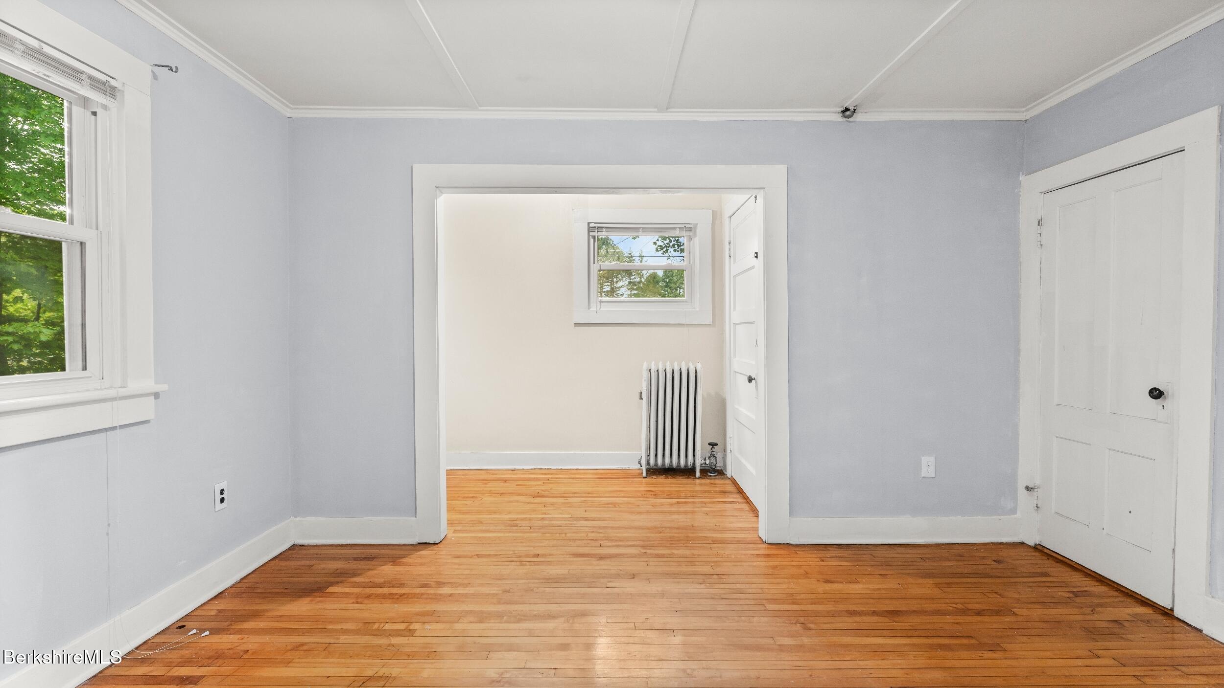 349 New Lenox Road Lenox, MA 01240 - Photo 15 of 22 a view of an empty room with wooden floor and a window
