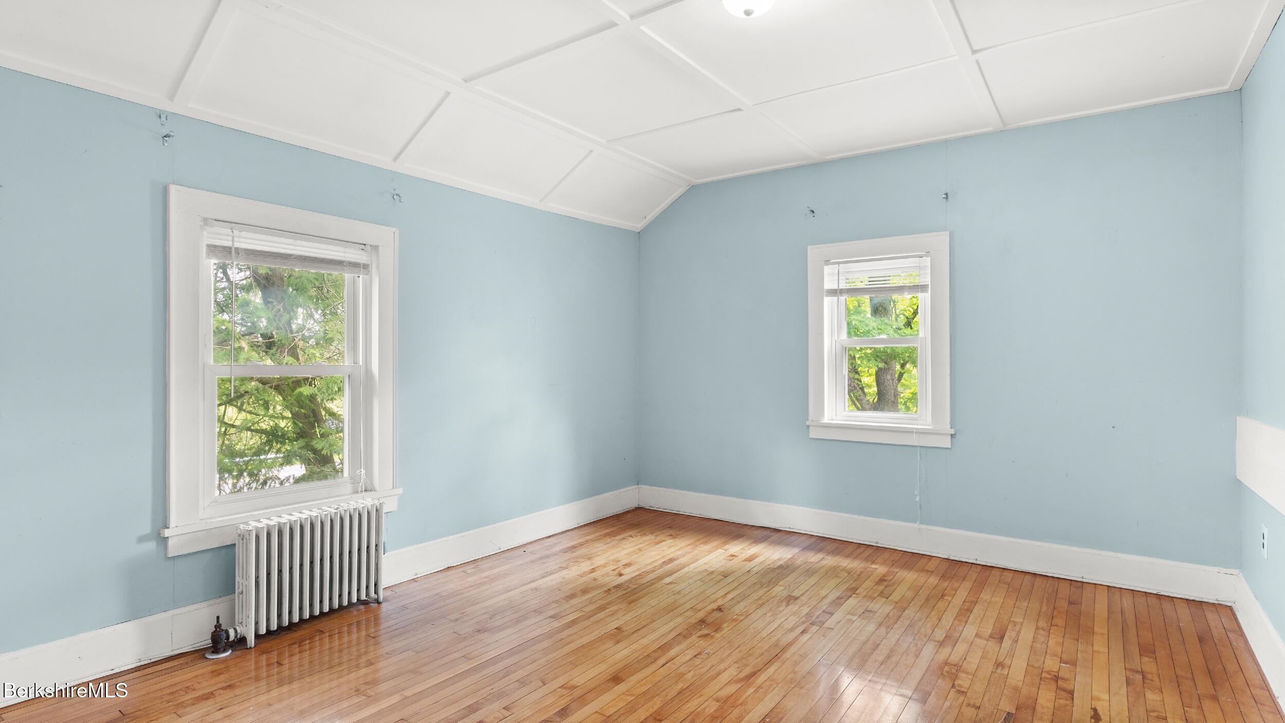 349 New Lenox Road Lenox, MA 01240 - Photo 19 of 22 a view of an empty room with wooden floor and a window