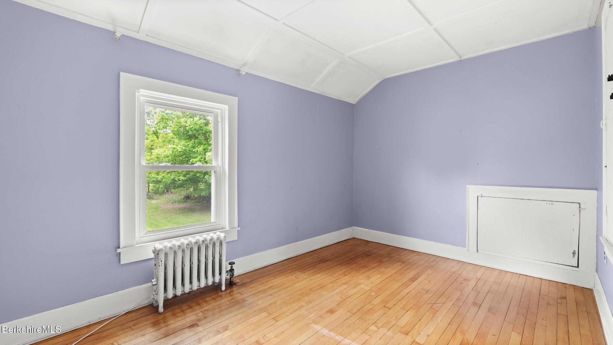 349 New Lenox Road Lenox, MA 01240 - Photo 20 of 22 an empty room with wooden floor and windows