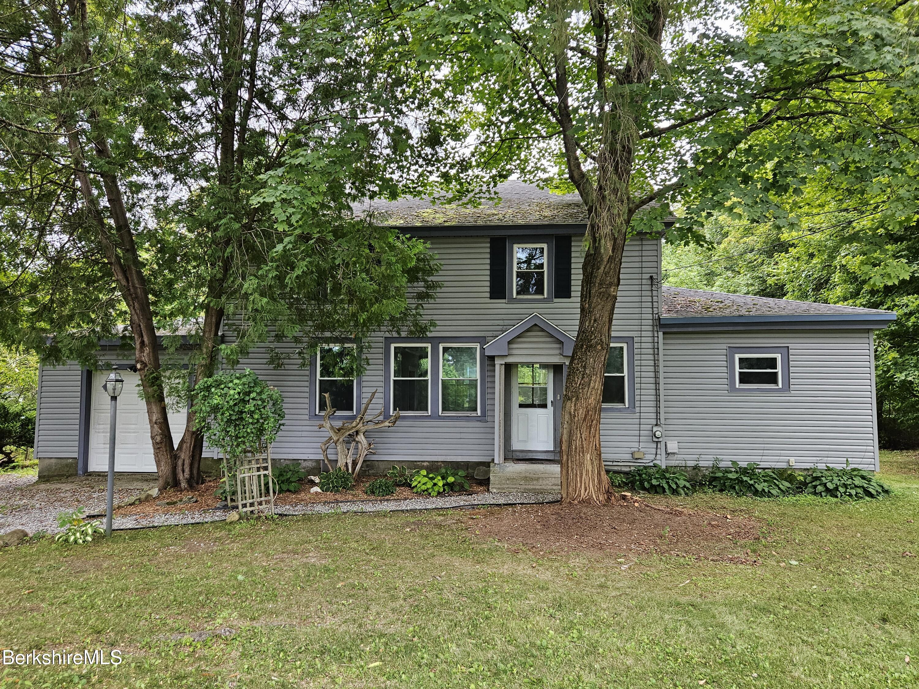 349 New Lenox Road Lenox, MA 01240 - Photo 2 of 22 front view of a house with a yard