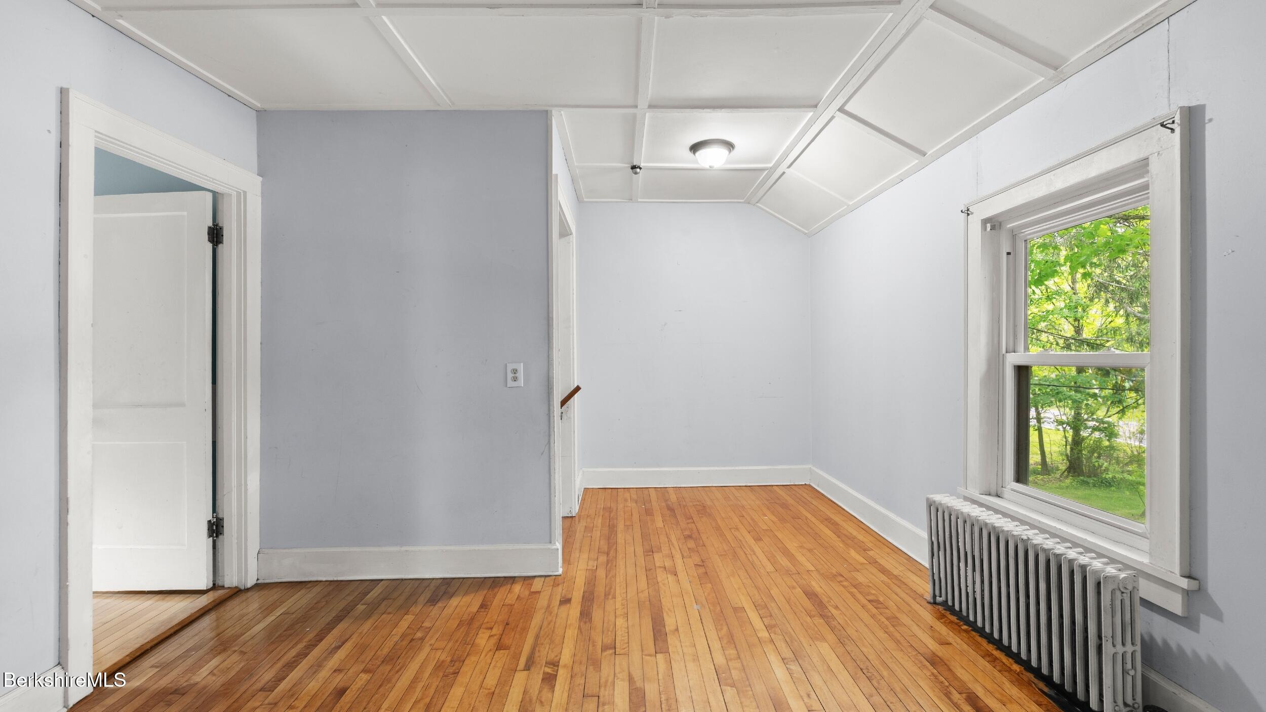 349 New Lenox Road Lenox, MA 01240 - Photo 21 of 22 a view of a room with wooden floor closet and windows