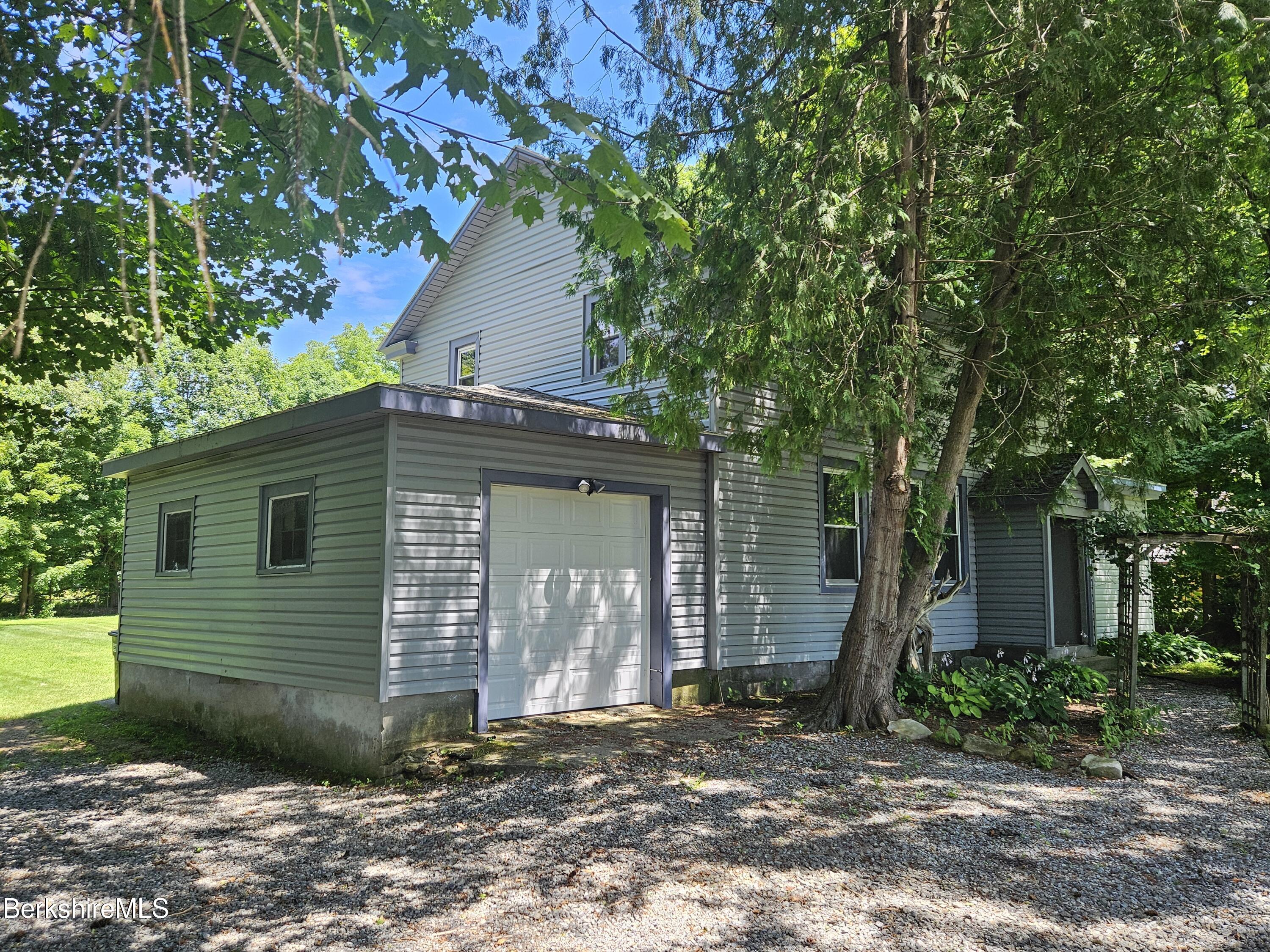 349 New Lenox Road Lenox, MA 01240 - Photo 5 of 22 a view of a house and a yard
