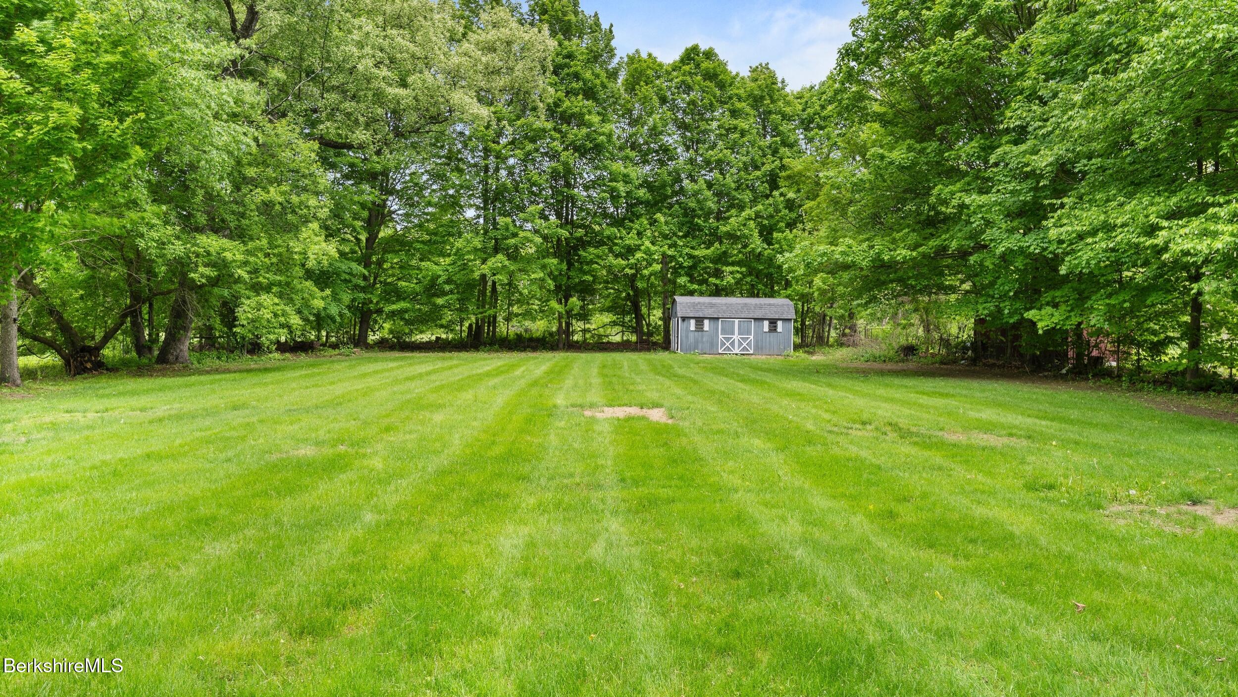 349 New Lenox Road Lenox, MA 01240 - Photo 7 of 22 a view of a house with a big yard