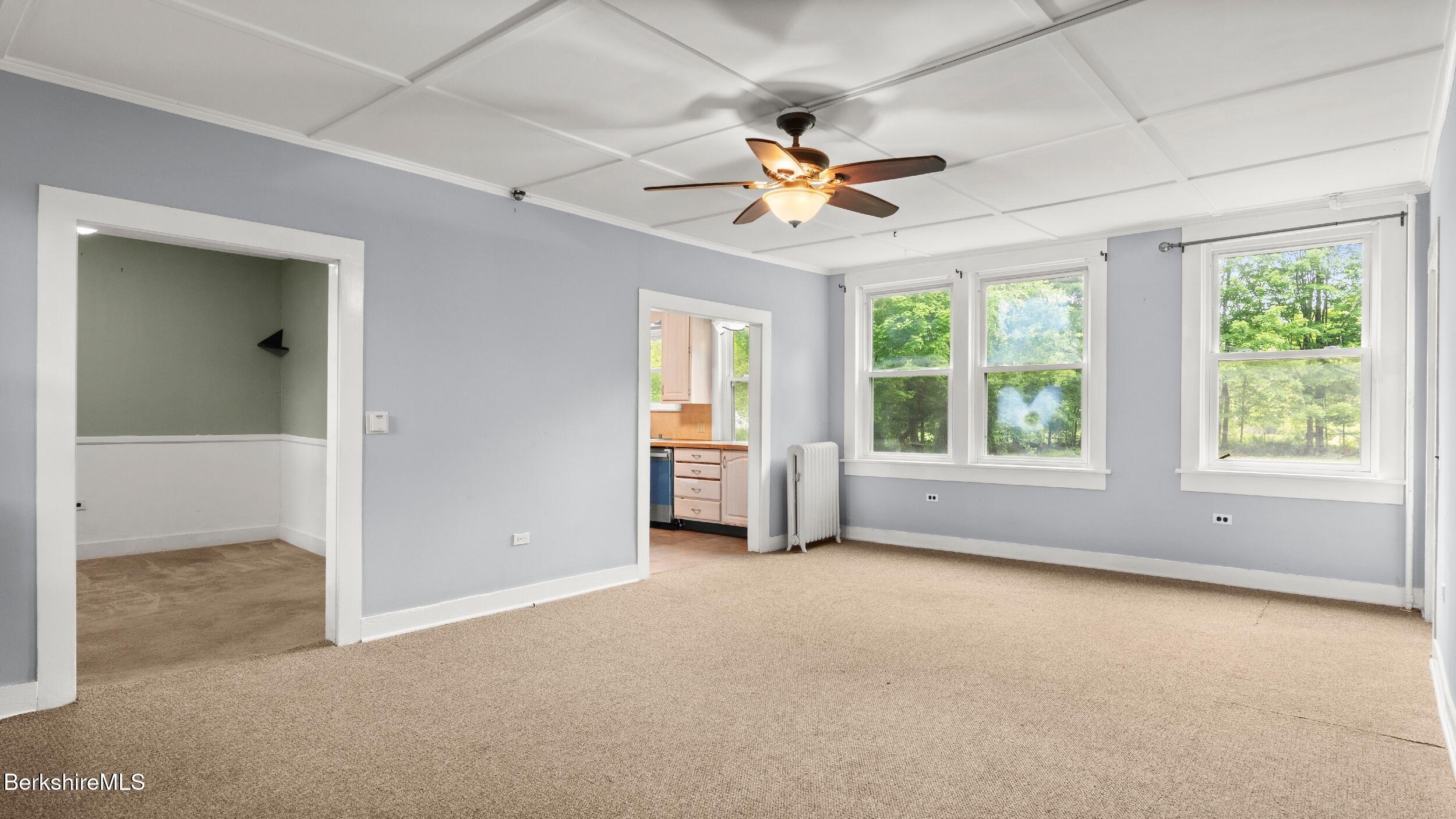 349 New Lenox Road Lenox, MA 01240 - Photo 8 of 22 an empty room with windows and fan