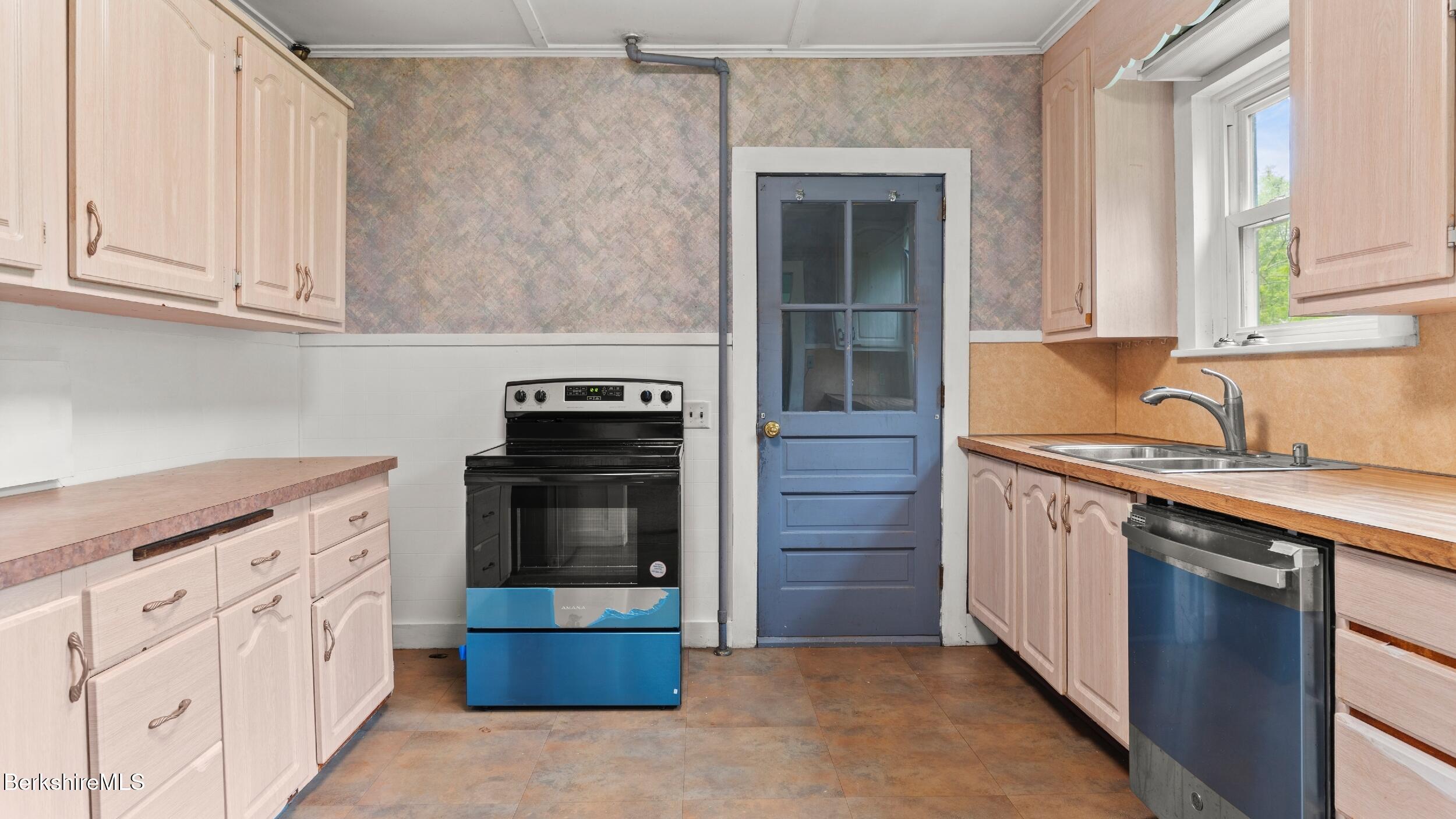 349 New Lenox Road Lenox, MA 01240 - Photo 10 of 22 a kitchen with stainless steel appliances granite countertop a stove and a sink