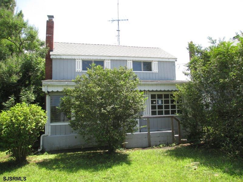 205 Pennsylvania Avenue Fortescue, NJ 08321 - Photo 1 of 1 a front view of a house with a yard and a garage