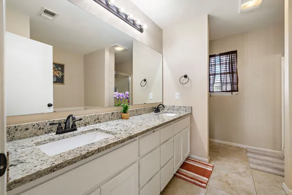 a white bath tub sitting next to a small window