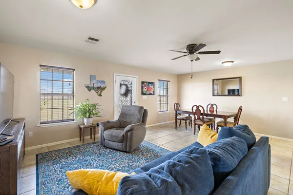 a kitchen with white cabinets sink and stainless steel appliances