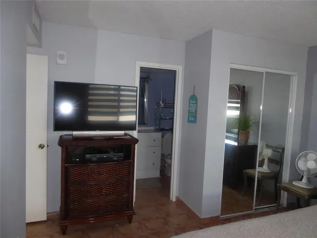 a kitchen with a stove and a refrigerator