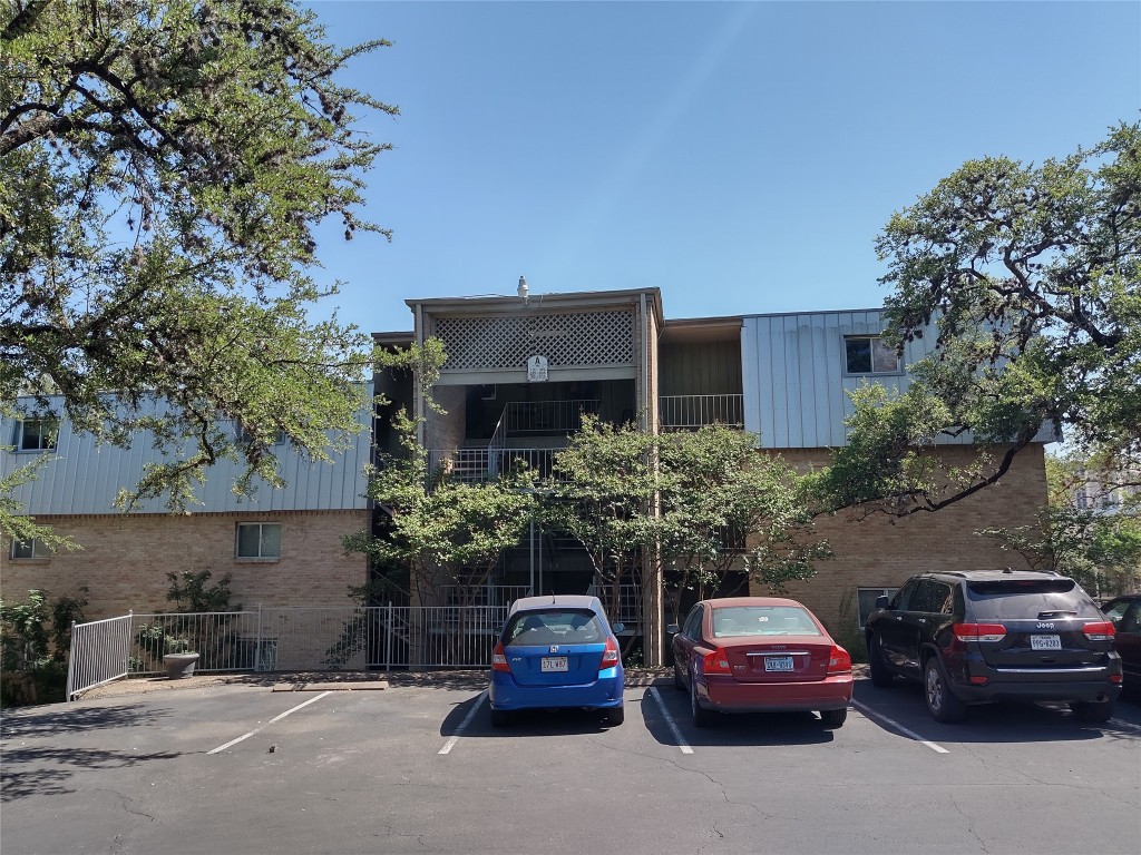 620 South 1st Street, Unit 106 Austin, TX 78704 - Photo 1 of 1 a car parked in front of a house
