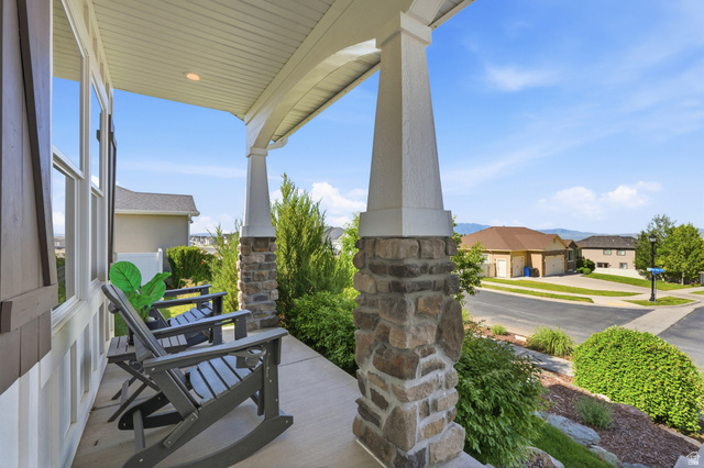 338 Windy Rdg Drive Smithfield, UT 84335 - Photo 6 of 63 Covered porch with stone-clad columns and recessed lighting
