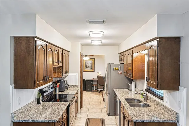 a very nice looking room with a large window and furniture