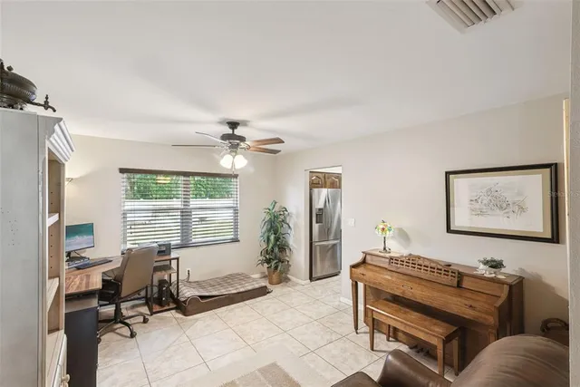 a bedroom with furniture and a window