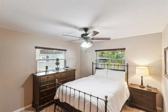 a bedroom with a bed and a table