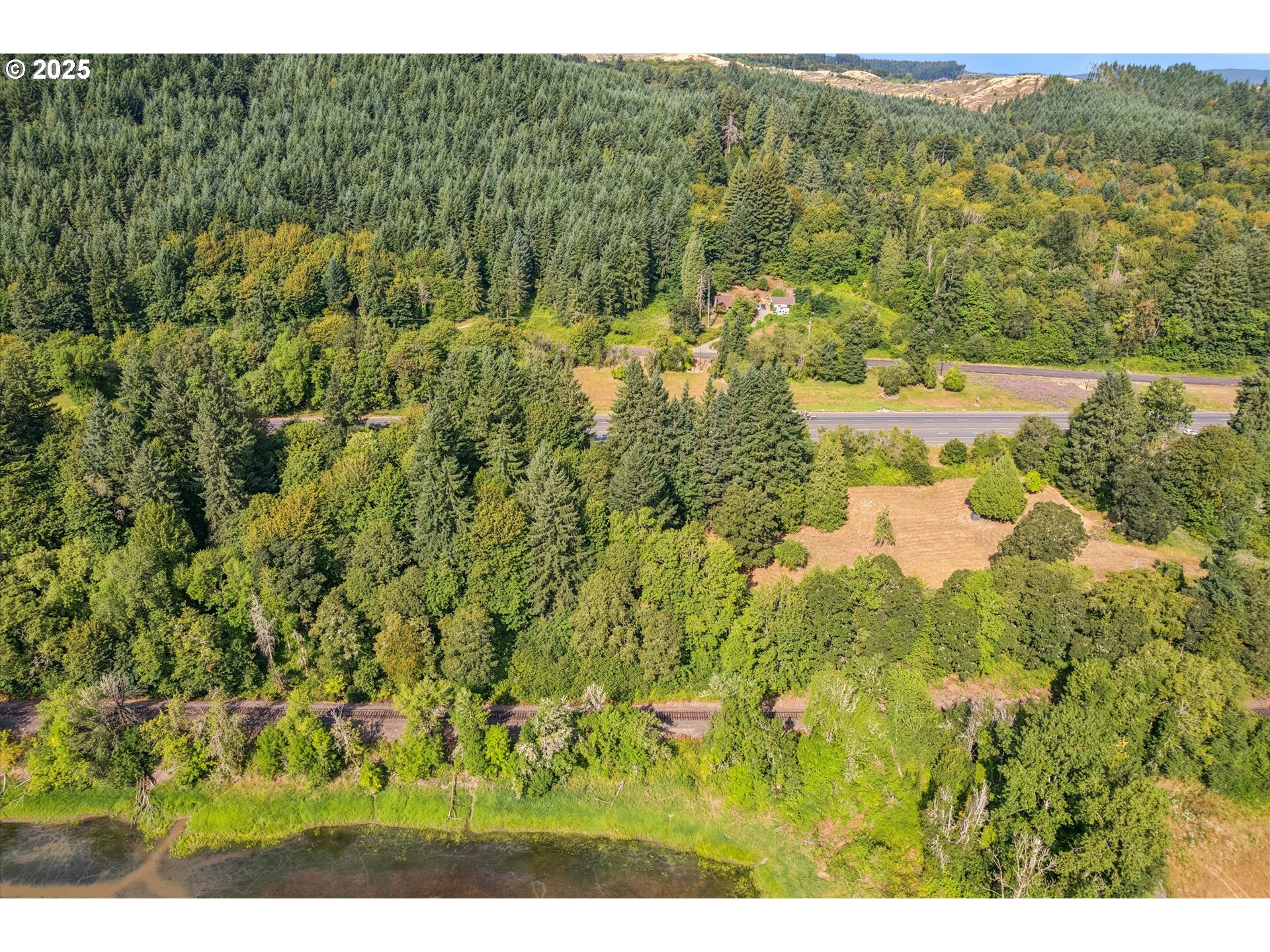 25900 Northwest St Helens Road Scappoose, OR 97056 - Photo 13 of 29 a view of a lake with a mountain