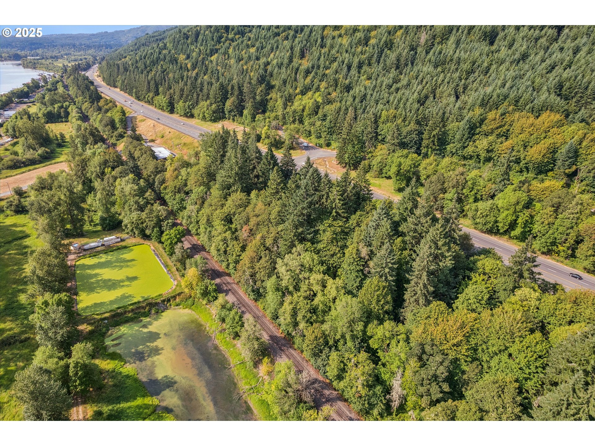 25900 Northwest St Helens Road Scappoose, OR 97056 - Photo 18 of 29 a view of a yard and an aerial view of a house