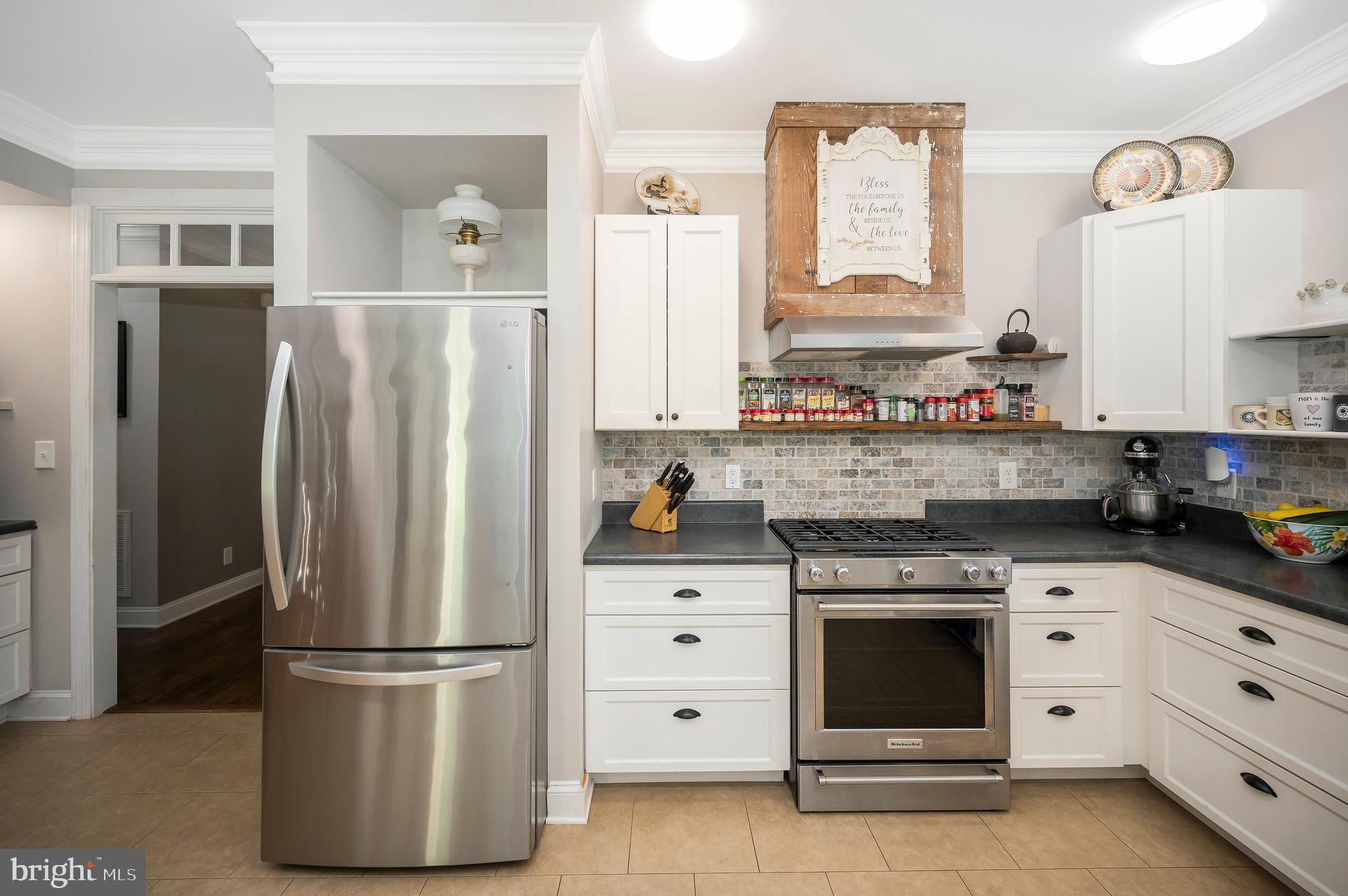 29288 Old Rhoadesville, VA 22542 - Photo 13 of 63 a kitchen with a refrigerator stove and white cabinets