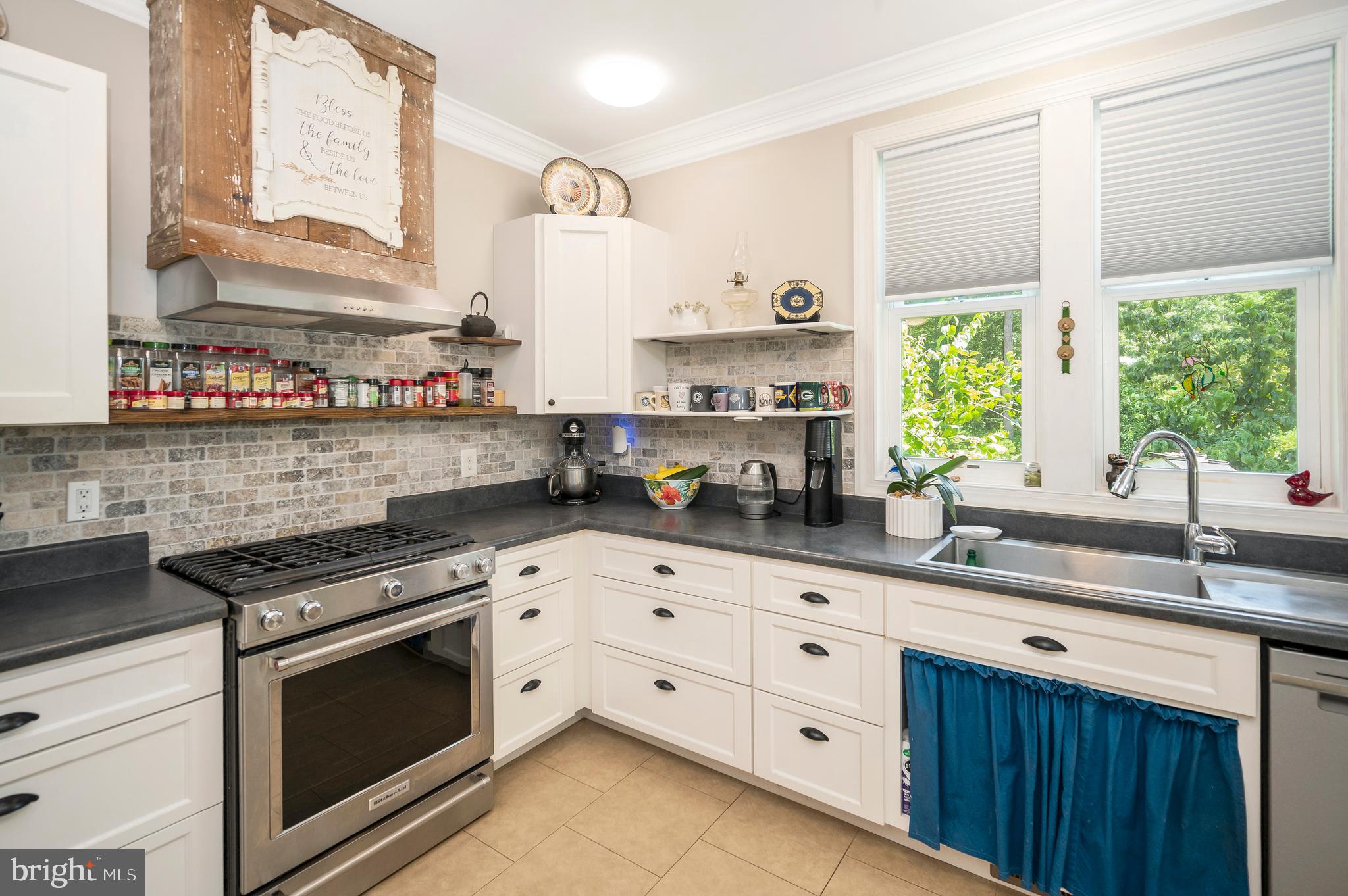 29288 Old Rhoadesville, VA 22542 - Photo 15 of 63 a kitchen with stainless steel appliances a white cabinets and a window