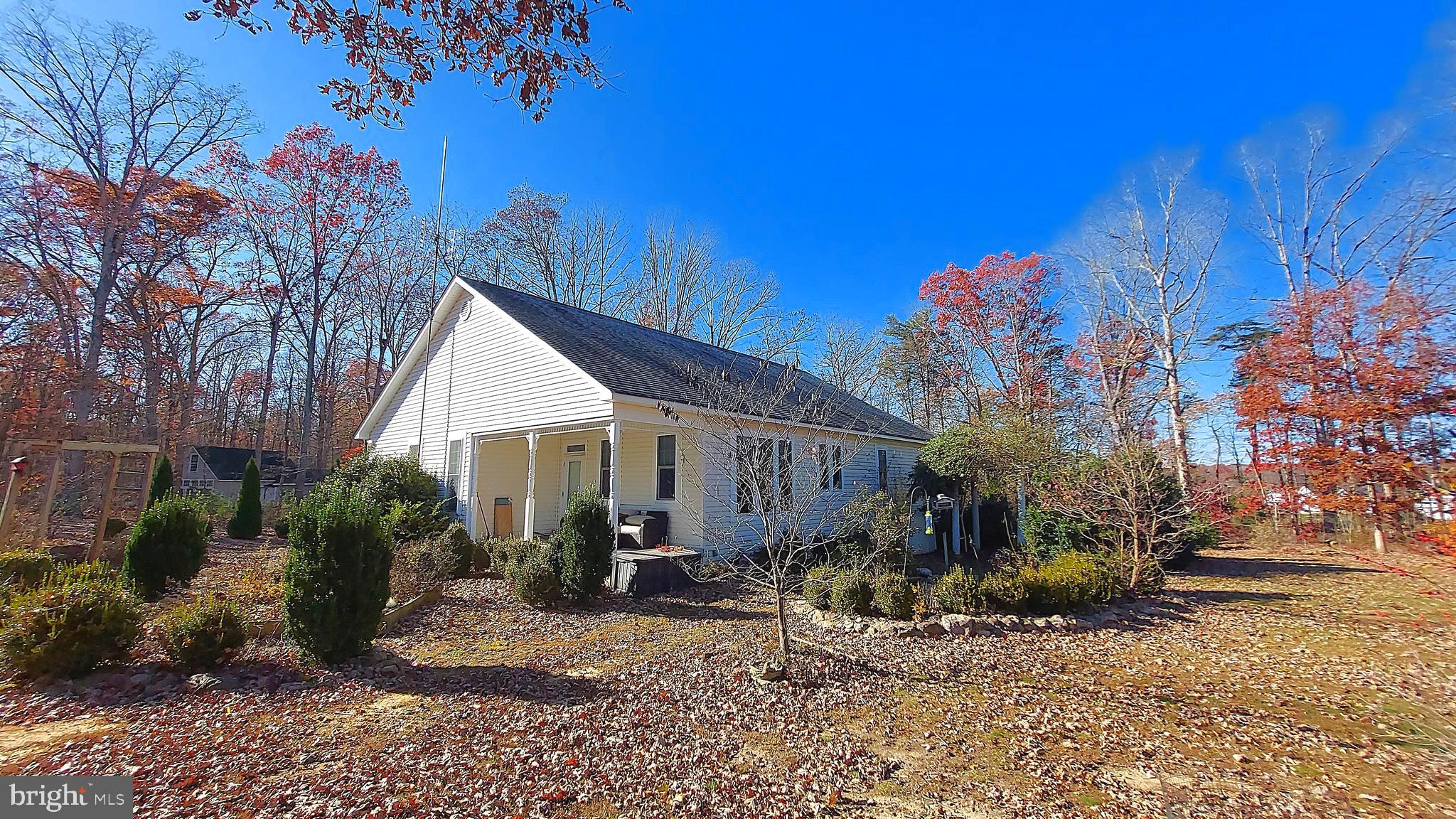 29288 Old Rhoadesville, VA 22542 - Photo 2 of 63 a view of a house with backyard and garden