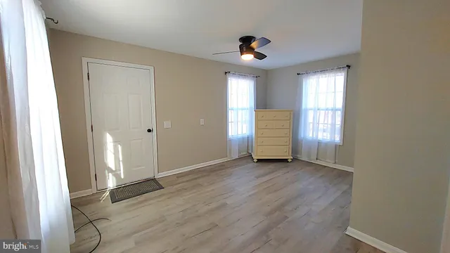 a bathroom with a sink vanity and mirror