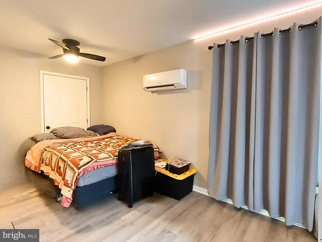 a house with lots of trees in the background