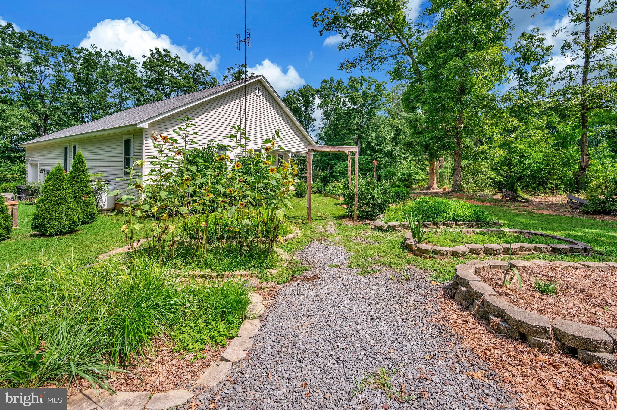 29288 Old Rhoadesville, VA 22542 - Photo 56 of 63 a view of a house with a yard and plants