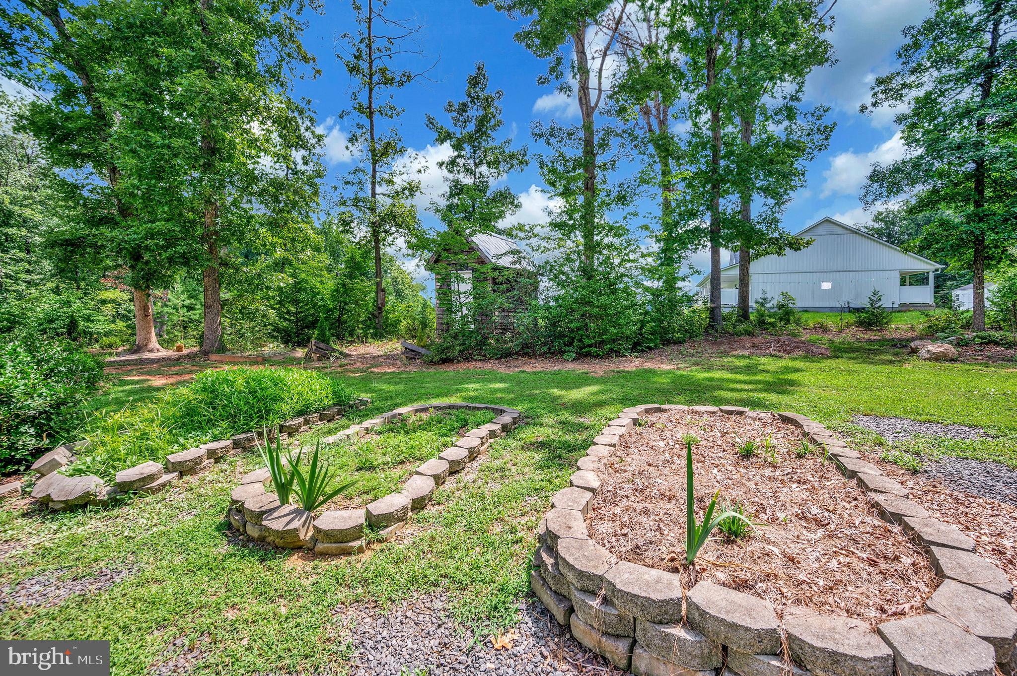 29288 Old Rhoadesville, VA 22542 - Photo 58 of 63 a view of a garden with a fountain