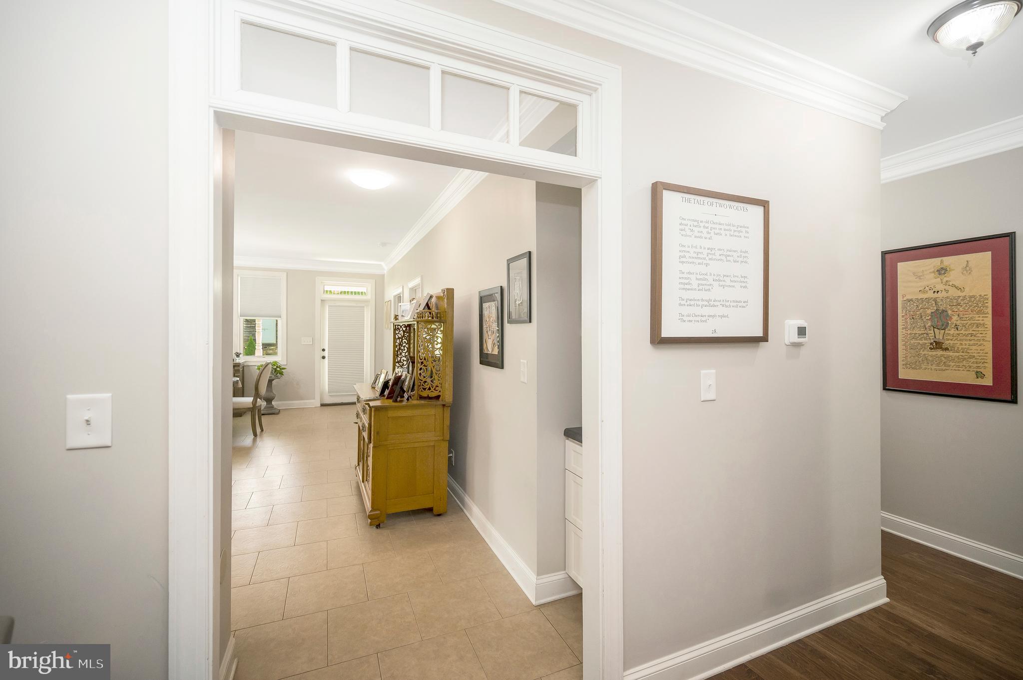 29288 Old Rhoadesville, VA 22542 - Photo 6 of 63 a view of a hallway with wooden floor and a bathroom