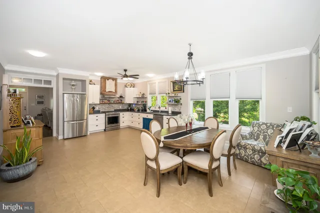 a view of a dining room with furniture window and outside view