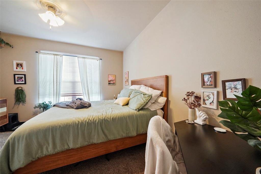 1198 Jones-Butler Road, Unit 203 College Station, TX 77840 - Photo 14 of 18 Bedroom with carpet flooring and a ceiling fan