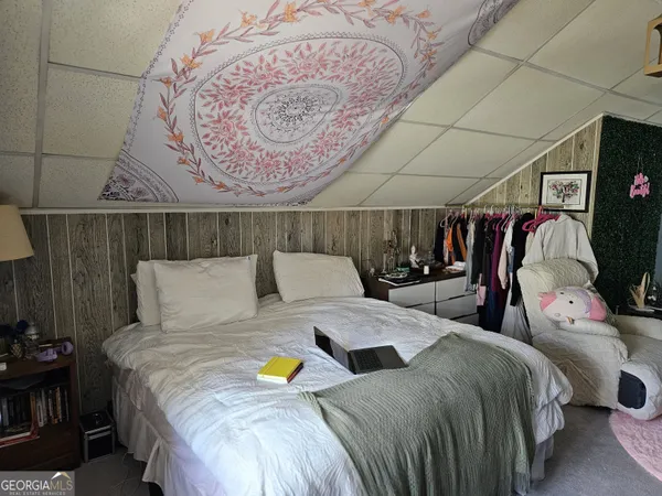 a bed room with two beds and a table