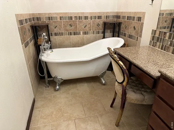 a view of a room with furniture and window