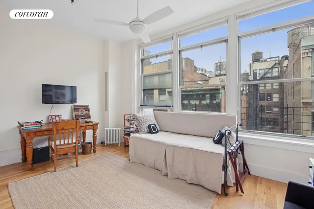 a bathroom with a granite countertop sink a mirror and a shower