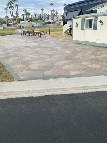 a view of a backyard with sitting area