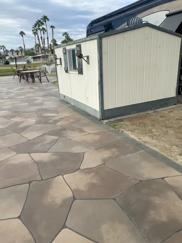 a view of a backyard with sitting area