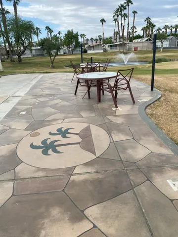 a view of a backyard with sitting area