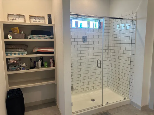 a white toilet sitting in a bathroom