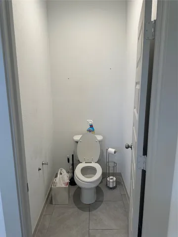 a view of walk in closet with clothes