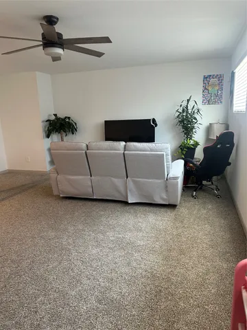 a bathroom with a sink vanity mirror and toilet